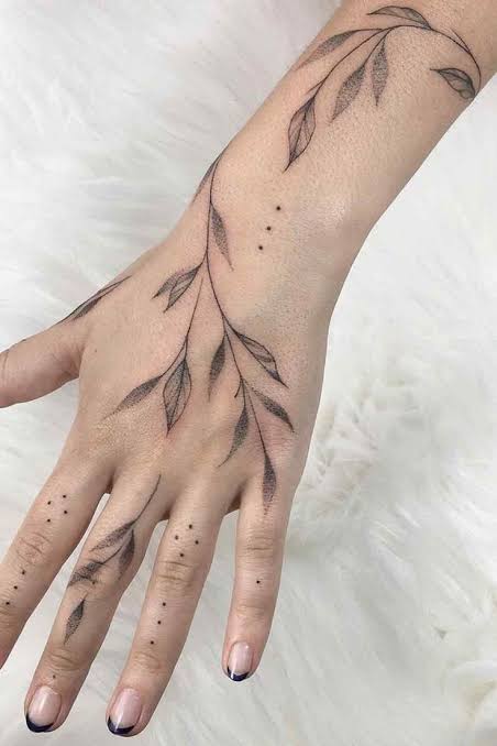Vines around hand tattoo | Vine tattoo finger to arm, Ivy vine hand tattoo, Tatoos