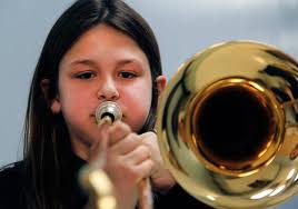 PHOTO GALLERY: Fifth-graders try out instruments at Lange Middle