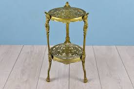 Maybe you would like to learn more about one of these? Antique Brass Lamp Or Plant Stand Ornate Tripod Flower Table In Decorative Pierced Metalwork On Claw Feet Victorian Design Furniture 1920s Victorian Design Brass Lamp Victorian Style Furniture