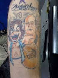 / and what will we do / about all the fans that have the d tattoo? act i: Rize Of The Fenix New Song From Tenacious D Geek News Network