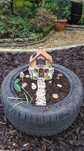 Fairy Garden Made From Old Tyre And Pebbles Collected From The Beach Kidsgardening Fairy Garden Fairy Garden Diy Miniature Fairy Gardens