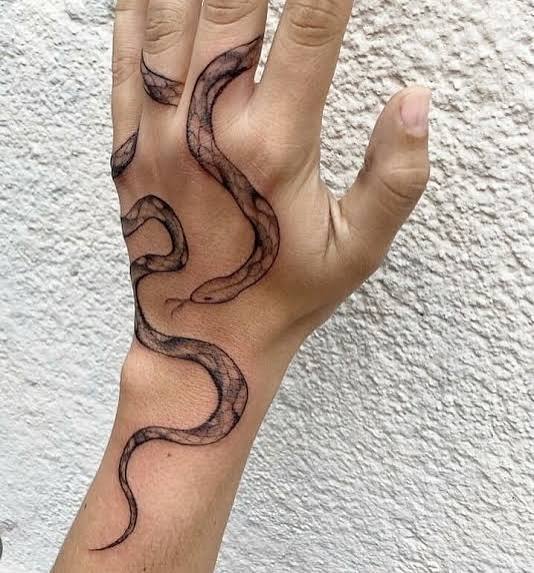 Snake tattoos that wrap around arm | Snake tattoo wrapping around arm, Minimal gothic snake tattoo, Snake finger tattoo