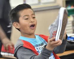 Photos: 100 students at Robert Bruce Elementary receive new shoes