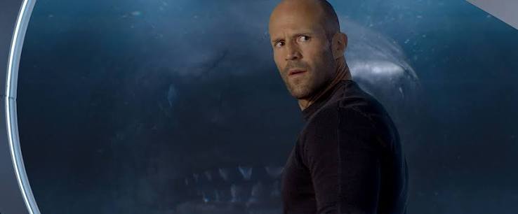 The Meg,' with its huge shark and a chiseled Jason Statham, is good, goofy  fun | The Seattle Times