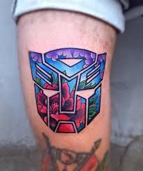 Cool tattoos vampire tattoo designs tattoo designs and meanings horse tattoo design tattoos geek tattoo music tattoo designs ace tattoo aztec tattoo designs. Amazing Rose In Transformer Logo Tattoo Design For Thigh