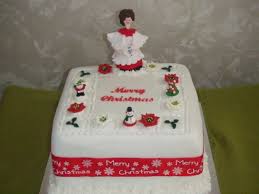 Christmas Cake With Holly Hand Made Choir Boy With Miniature Santa Bear Snowman And Poinsettias Cakes For All Occasions M Cake Christmas Cake Merry Christmas