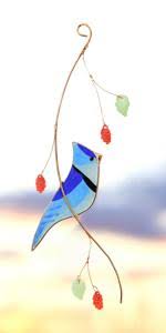 That distinct bold blue color combined with the unmistakeable bold tempermant, make the blue jay a favorite! Amazon Com Lolitarcrafts Blue Jay Stained Glass Sun Catcher For Window Hanging A Lovely Gift For Your Family Garden Outdoor