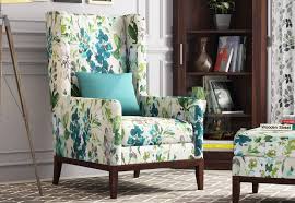 The wood frame and solid wood tapered legs ensure that the teagan armless chair will get years of quality use. Buy Joan Lounge Chair Fabric Aqua Flower Online In India Wooden Street