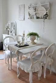 This simple dining room combines elements of the shabby chic trend with distressed furniture, a neutral colour palette and vintage touches, while natural wood adds a rustic feel. Vintage Chic Shabby Chic Dining Room Chic Dining Room Shabby Chic Dining