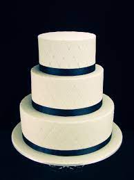 Quilted Fondant Wedding Cake With Edible Pearls On Chocolate Mud Cakes Middle Tier Is White Ch Navy Blue Wedding Cakes Wedding Cake Pearls Wedding Cake Ribbon