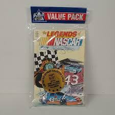 Includes collector cards bound in center of book. Let S Go Racing Nascar Collectables