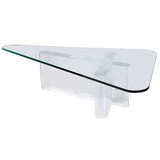Since glass is a very popular material nowadays, the majority of people chooses glass coffee tables, that look very stylish and modern. Lucite Coffee Table By Lion In Frost With Triangular Glass Top At 1stdibs