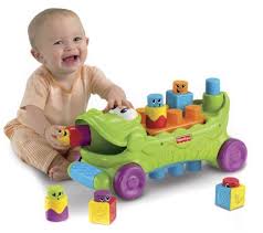 Amazon Com Fisher Price Stack N Surprise Blocks Musical Croc Block Wagon Toys Games Best Baby Toys Educational Baby Toys Toddler Toys