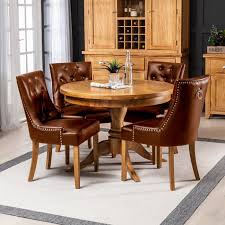 Dining chairs are all known for their eclectic mix of modern and vintage style. Solid Oak Round Dining Table And 4 Brownfaux Leather Scoop Chairs The Furniture Market
