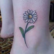 30 Daisy Flower Tattoo Designs Little Daisy Flower Daisy Flowertattoo Tattoos Couplestattoossmall Small Daisy Tattoo Daisy Flower Tattoos Daisy Tattoo