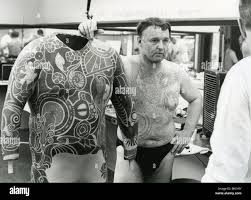 ROD STEIGER in makeup for 1969 Warner film The Illustrated Man with the  artwork for the tattoo he has had painted