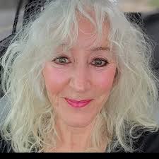 Who is the teacher in the photo and what subject did they teach?