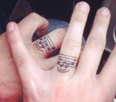 27 Creative And Personal Music Tattoos Music Tattoo Designs Wedding Band Tattoo Ring Tattoo Designs