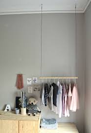 You can build your own clothes rack with a few basic tools—plus can be moved anywhere, and takes up very little space. Hang On With This Diy Hanging Clothes Rack Diy Home Decor Your Diy Family Hanging Clothes Racks Diy Clothes Rack Clothes Rack Design