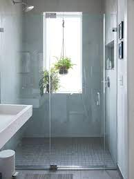 I Also Swear By The Wall Tiling In There It S A Material Called Laminam And It Has No Grout Which Means I Window In Shower Bathroom Inspiration Shower Room
