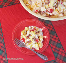 Cut fruit into bit sized chunks and marshmallows and in half put into large bowl warm marshmallow cream in microwave for 30 seconds and blend in cream cheese and whipped topping until a mayo like texture mix together store in the fridge until ready to serve Recipe Of The Week Ambrosia For Thanksgiving