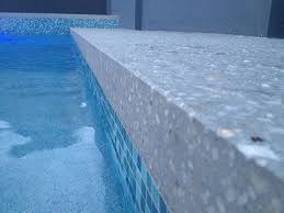 For instance exposed aggregate borders with coloured center areas or exposed aggregate concrete with paver borders. Mcginn Concrete Polished Concrete Specialists Brisbane And South East Queensland Polished Concrete Stone Pool Deck Concrete Pool Surround
