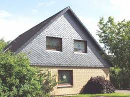 Haus Mit Gesicht Aus Fenstern Fassadenverkleidung Durch Die Dachdeckerei Heiko Oehlert Gmbh Co Kg In Harrislee 24955 Dachdecker Style At Home Dach Haus