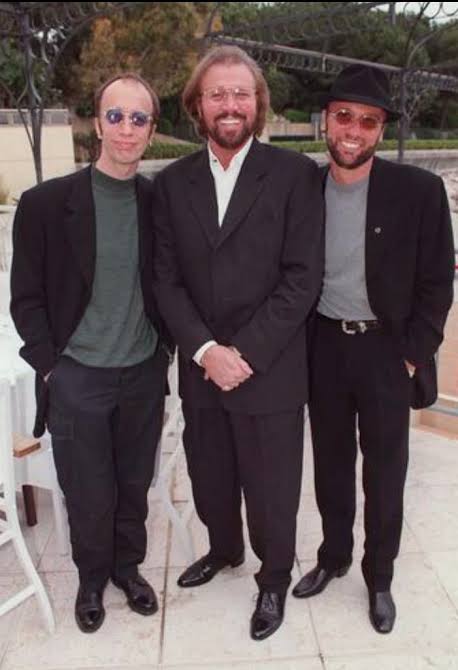 Looking back to the 2004 investiture for the Bee Gees CBE. The two  surviving members of the Bee Gees, Robin (left) and Barry Gibb hold their  CBE's after receiving them from the
