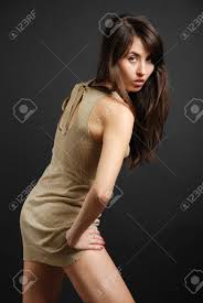 Dark-haired Girl Bending Forward In Short Dress, Provocative Look Stock  Photo, Picture and Royalty Free Image. Image 4492177.