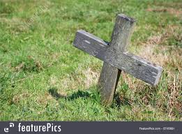 How do you live with your guiltiest secret? Photo Of Small Wooden Cross In A Graveyard
