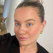 With dog housemates in Walter Peak, Te Anau