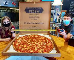 Approximately 154 square inchesa large pizza hut pizza has a diameter of 14 inches or approximately 154 square inches. Is This 32 Inch One Topping Titan The Largest Pizza In Tampa Bay Pmq Pizza Magazine