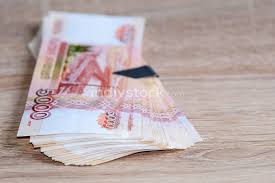 Can hold a stack of 50 money ammo per 'clip'. A Stack Of Paper Bills With A Money Clip The Fan Is Lying On The Table Indivstock