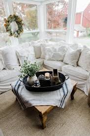 A coffee table is a vital piece of furniture that ties the whole living room together. A Farmhouse Style Coffee Table In The Sunroom Liz Marie Blog