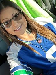 Hi all! I just wanted to introduce myself and share a photo I took of two  huge season ticket holder fans. GO HAWKS!