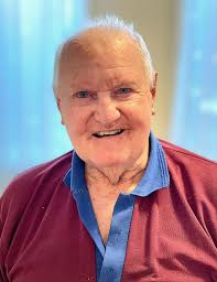 Peter Mullins (Manager) and Cate Howard (Family Support) delivering a car  boot load of groceries donated by Holy Cross Funerals for the Breakfast  Club Redcliffe homeless Christmas appeal.