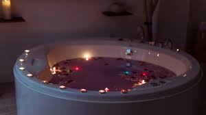 Call the elements, and light a lavender colored candle. Free Photo Flower Petals In Spa Tub With Violet Water And Burning Candles On Edges