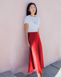 Characterized by or exhibiting refined, tasteful beauty of manner, form, or style. The Simple Yet Elegant Outfit We Re Going To Be Wearing On Repeat This Summer Silk Skirt Outfit Elegant Outfit Red Skirt Outfits