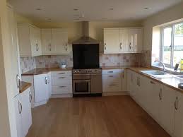 Add a touch of traditionalism by pairing gloss units with wooden worktops. Consider Oak Worktops To Add Stunning Golden Colour To Light Coloured Kitchens Kitchen Kitchen Fittings Oak Worktops