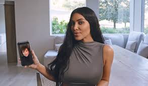 One bedroom has a huge bed with cream headboard and white bedding, and wooden bedside tables on either side. Kim Kardashian Gives A Tour Of Her Bizarre All White Minimal Monastery House With No Doors And Open Plan Bedroom In Vogue S 73 Questions