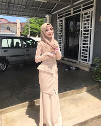 Relaxed fit high neck top in ivory. Raya