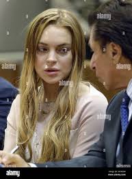 Actress Lindsay Lohan, attorney Mark Heller, attorney Anthony Falengetti,  left, at a hearing in Los Angeles Superior Court Monday, March 18, 2013.  (AP Photo/Reed Saxon, Pool Stock Photo