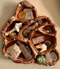 i made this little trinket shelf from air dry clay last winter and it got  broken in the move. finally got around to putting it back together and  setting it up