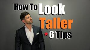 Standing up straight can make you look taller. How To Look Taller 6 Style Tips To Appear Taller Than You Are Youtube