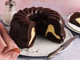 schoko gugelhupf mit cheesecakefullung saftig lecker die besten backrezepte mit gelinggarantie rezept in 2021 kuchen rezepte einfach kuchen und torten rezepte backrezepte