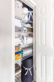 If you're starting with an empty space, consider using wood or wire shelves for. A Small Organized Linen Closet And Ideas To Store Bulky Bedding Kelley Nan