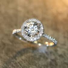 This Halo Engagement Ring Is Designed For Those Who Love Simple Yet Elegant C Round Halo Engagement Rings Diamond Engagement Rings Halo Diamond Engagement Ring