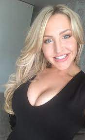 A young woman journalist with a microphone and a cameraman. Leeds Tv Presenter Emma Louise Jones To Dazzle Premier League After Marcelo Bielsa Leads Team To Promotion