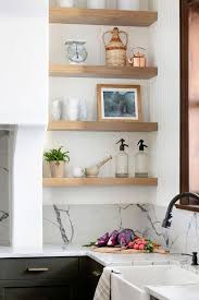 Kitchen floating shelves will make your room unique. Light Brown Oak Floating Shelves In Nook Next To Kitchen Sink Cottage Kitchen