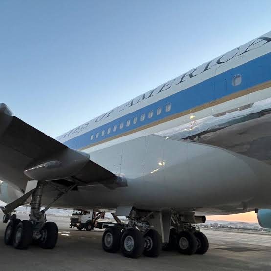 A catering truck parked near a tarmac, symbolic of the tactical decoy used to secure the former president's departure.